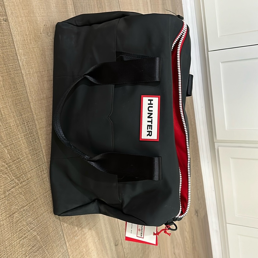 Brand new, never used Hunter for Target navy duffel bag.